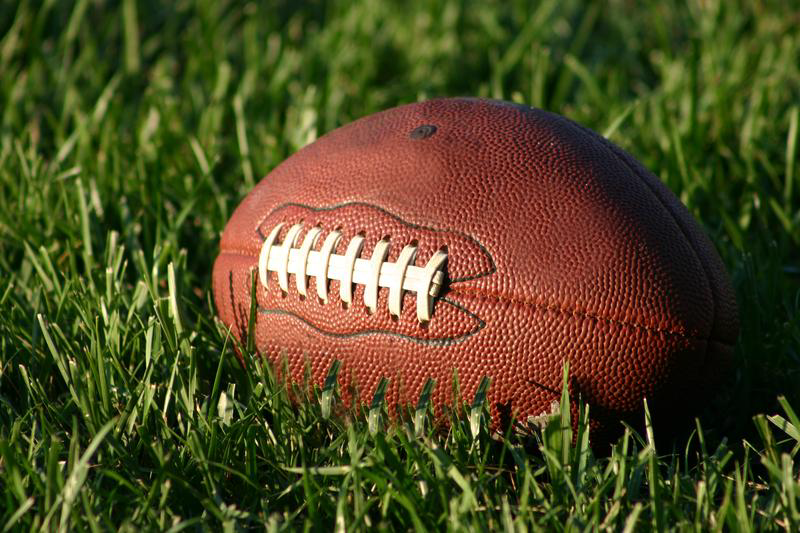 Football on Grass Field