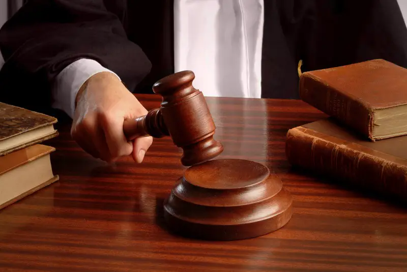 Judge with Gavel in Courtroom